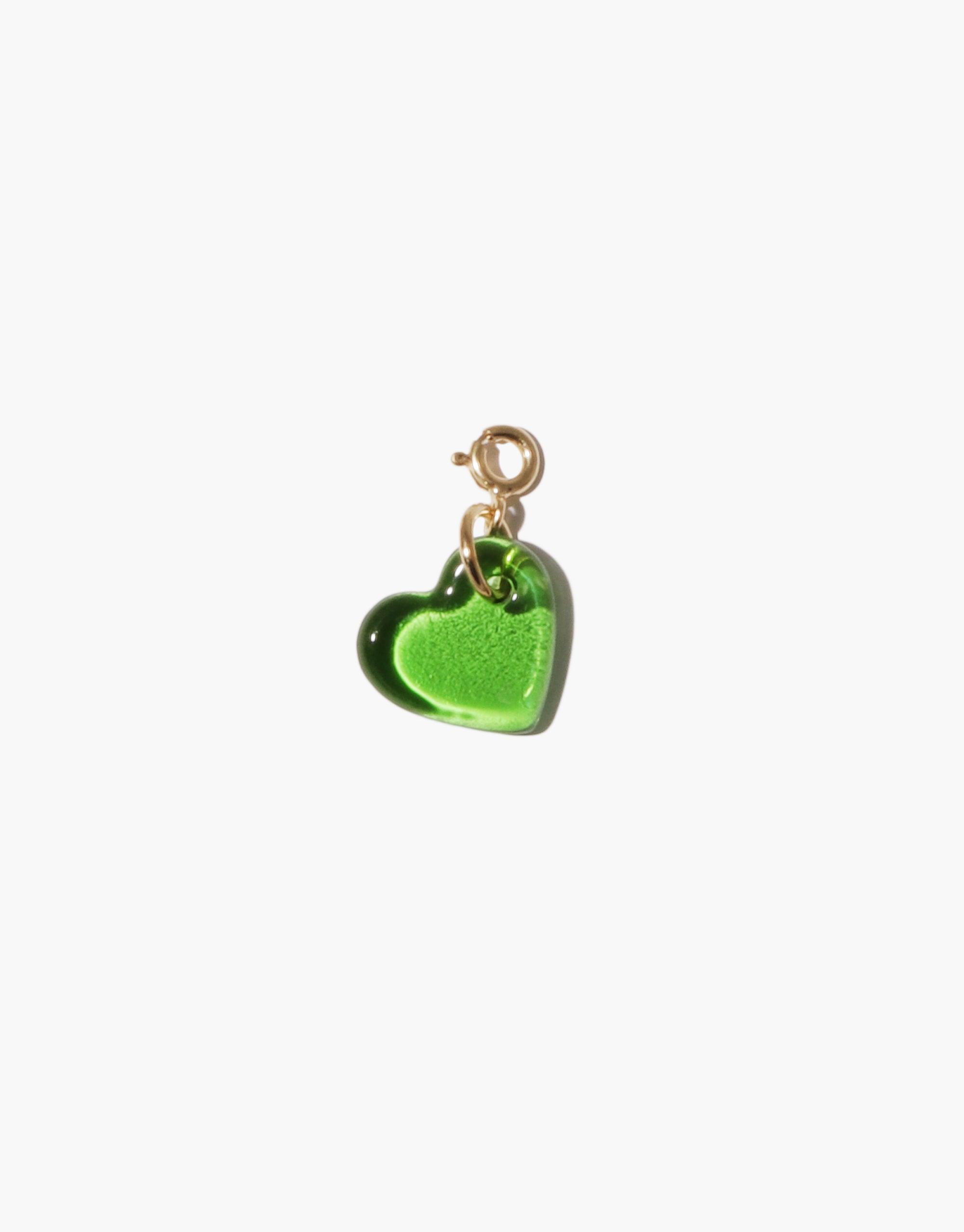 Small heart-shaped charm in vibrant green glass with gold metal clasp, perfect for adding to necklaces or bracelets. Handmade eco-friendly accessory showcasing upcycled materials. Heart Icon Charm by CLED