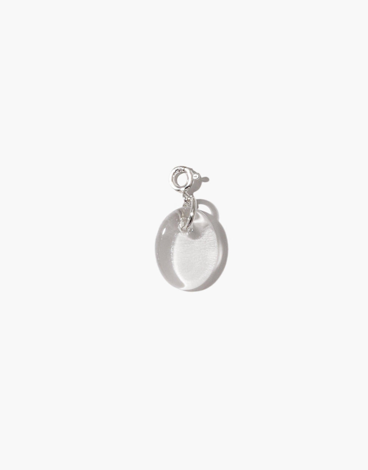 Oval Icon Charm featuring a translucent, smooth oval-shaped pendant made from upcycled glass, attached to a sterling silver clasp. Elegant and minimalist design, perfect for customizing necklaces or bracelets. Handcrafted eco-friendly jewelry by CLED.