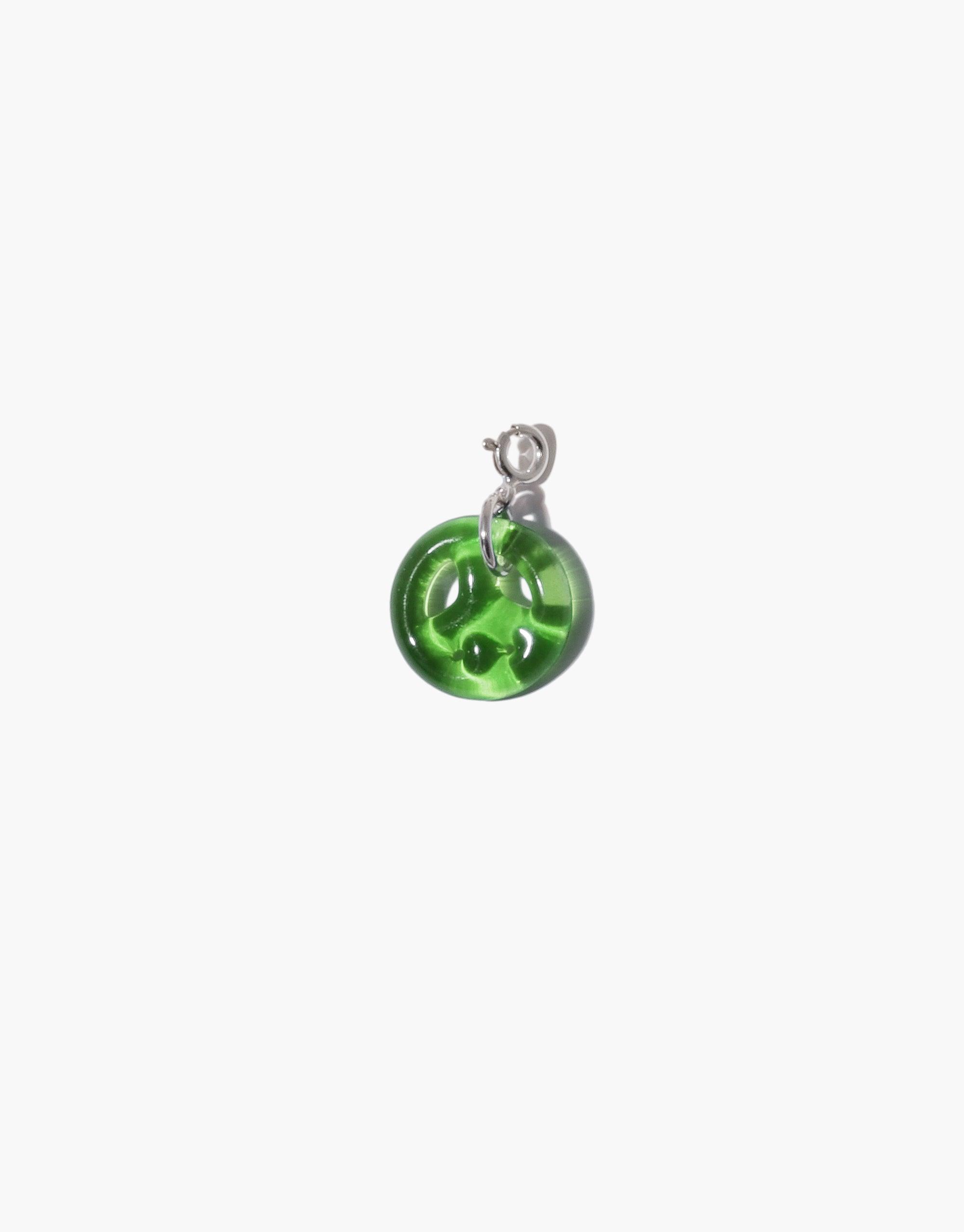 Green glass peace symbol charm with silver attachment, handcrafted from upcycled eco-friendly materials. Versatile accessory for necklaces or bracelets. Peace | Icon Charm by CLED