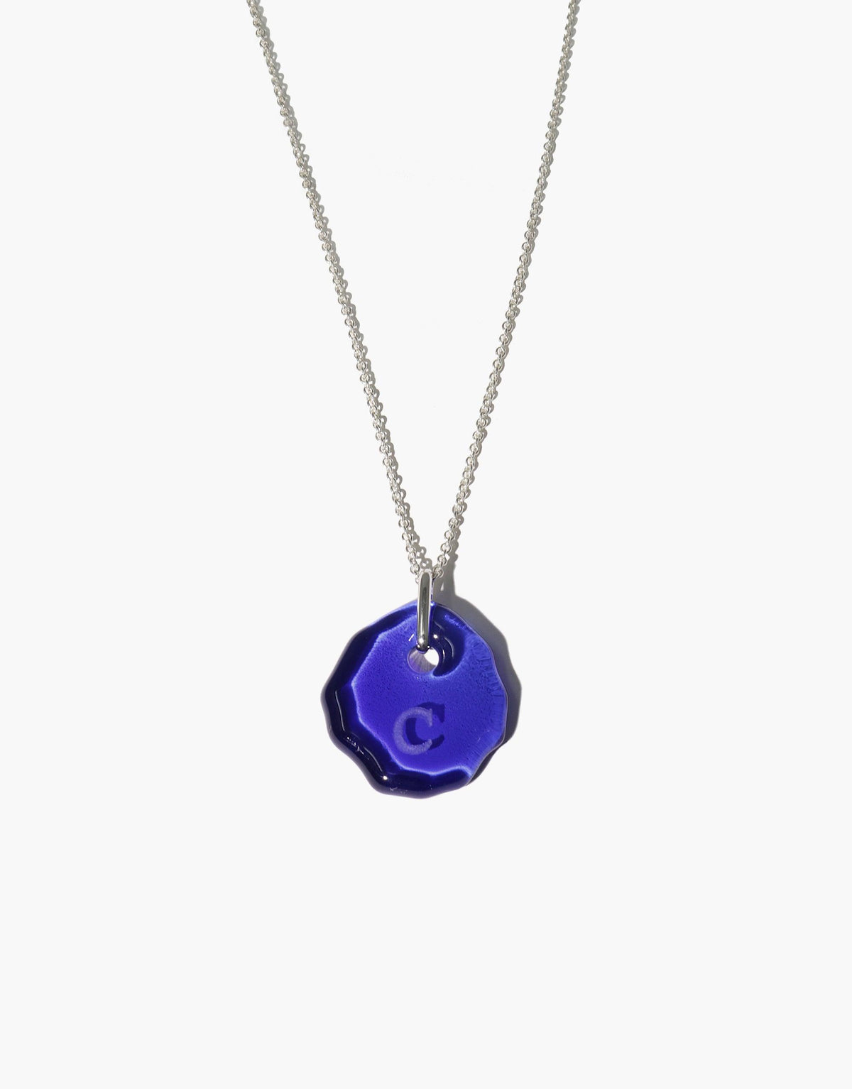 Messenger Necklace with clear engraving on vibrant blue eco gem pendant, suspended from delicate silver chain. Personalized, sustainable jewelry for sharing meaningful messages. Adjustable length, handmade in Los Angeles. CLED Messenger Necklace | Clear Engraving