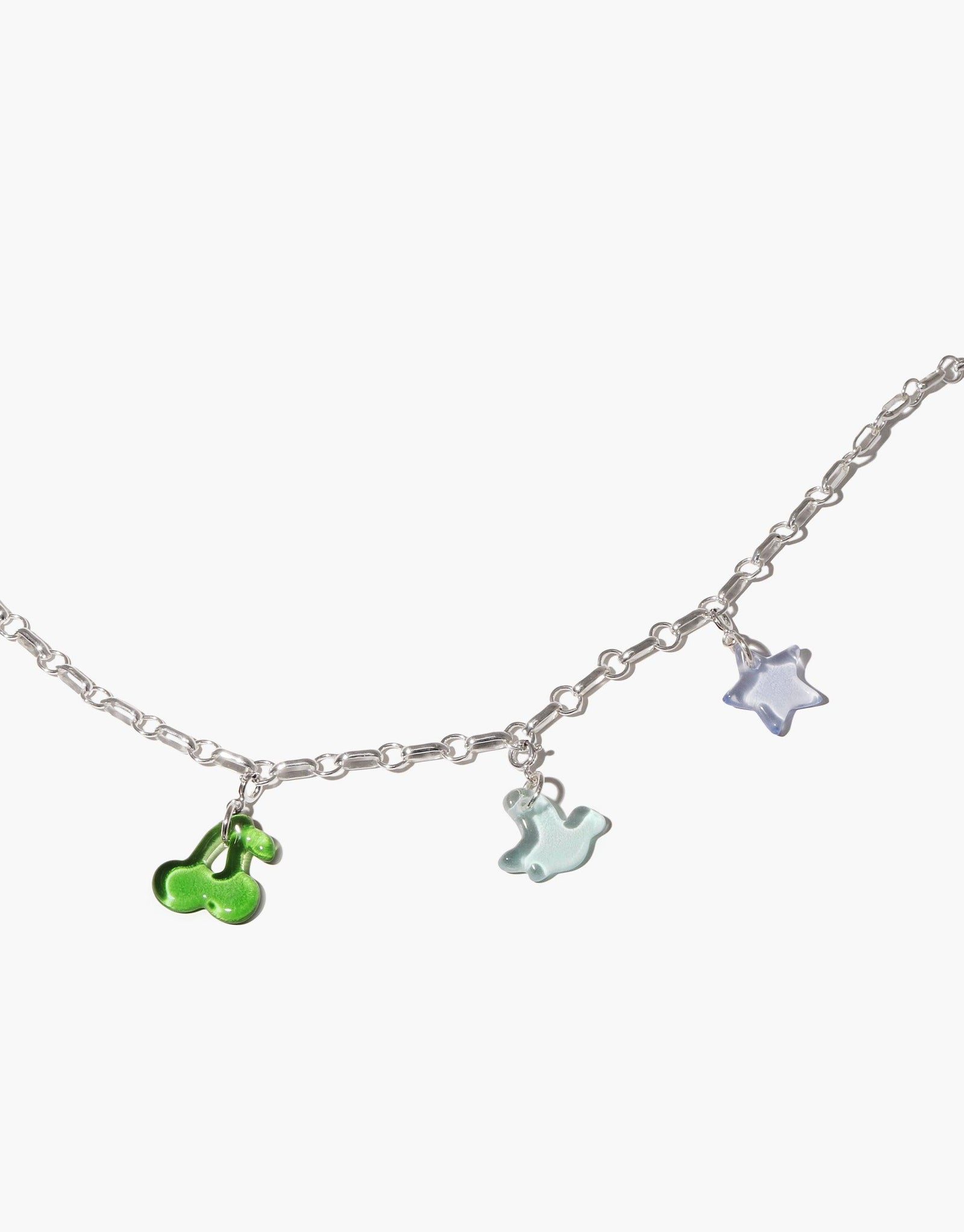 Delicate silver chain necklace with colorful glass charms including green cherries, blue ghost, and purple star. Customizable Icon Chain Necklace for versatile styling. Icon Chain Necklace | A by CLED