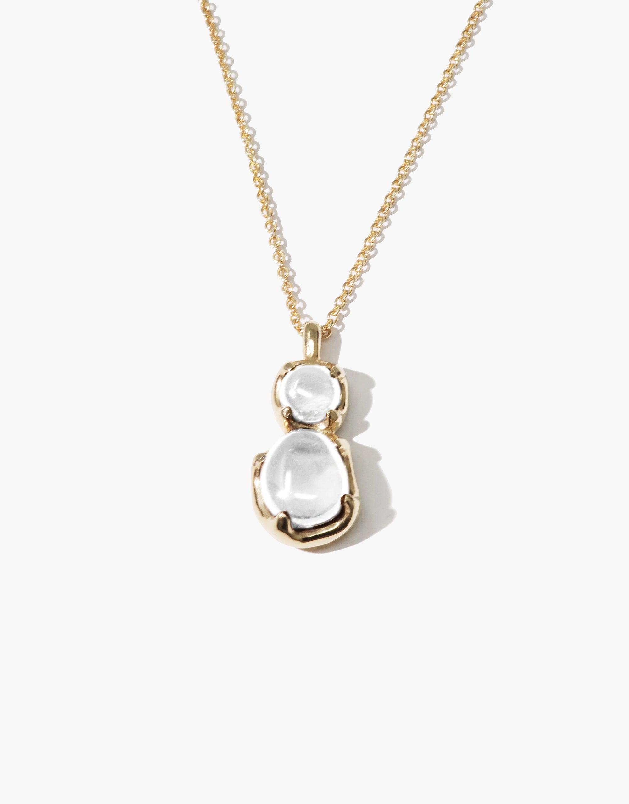 Elegant Duo Beam Necklace featuring two translucent eco gems in gold-toned setting, suspended on a delicate chain. Handcrafted sustainable jewelry inspired by prismatic light refraction. CLED Duo Beam Necklace.