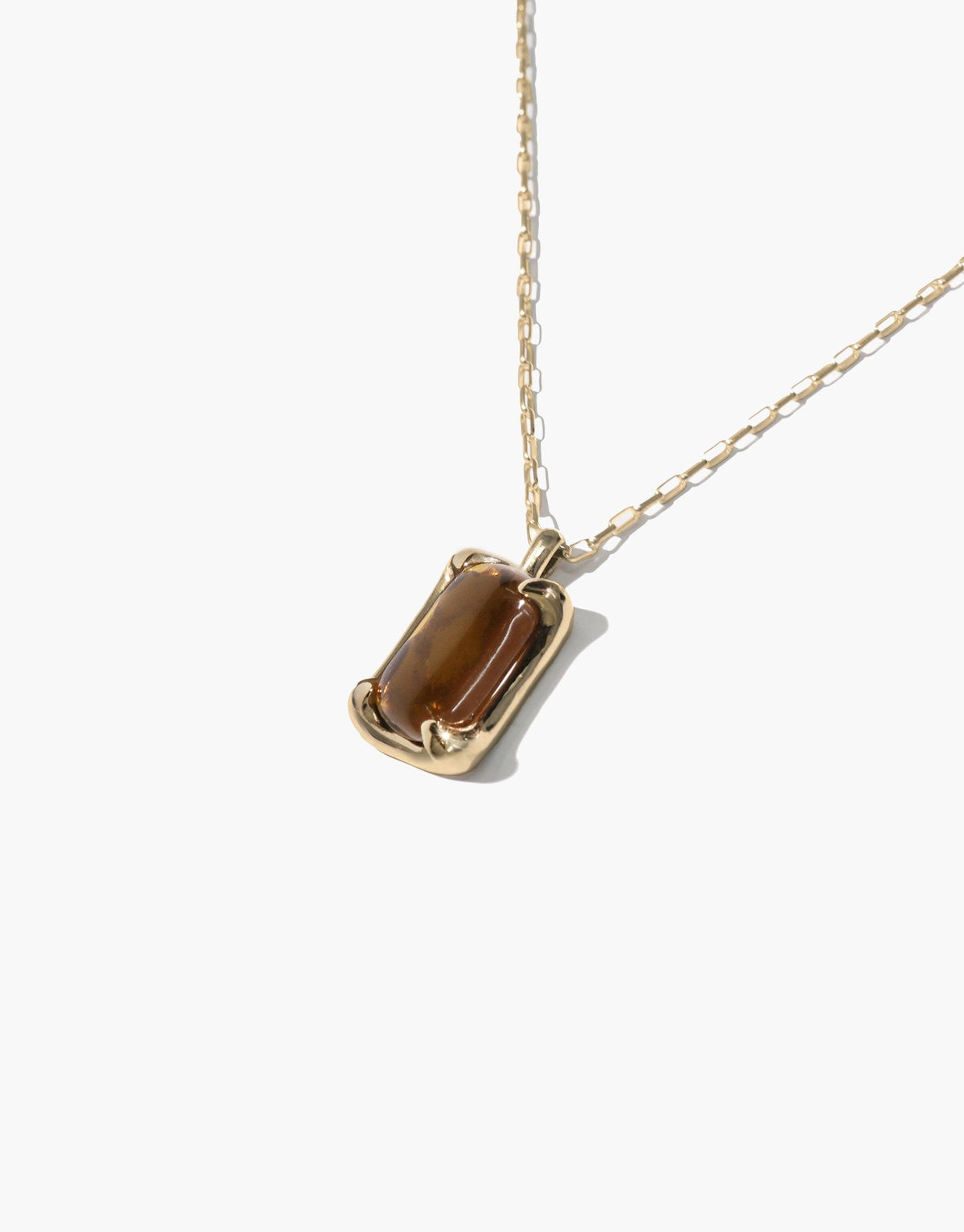 Prism Necklace featuring a golden chain with a rectangular pendant showcasing a brown eco gem repurposed from discarded glass, reflecting sustainable luxury and spectral colors inspired by natural light refraction, handcrafted in Los Angeles by CLED