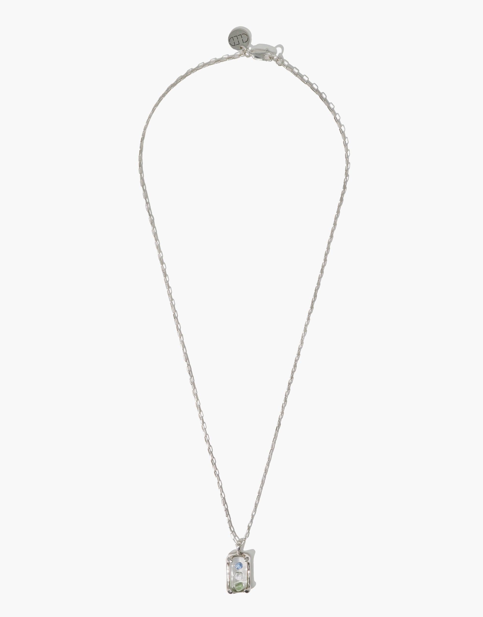 Elegant Prism Necklace featuring a delicate silver chain and rectangular pendant with iridescent eco gem, showcasing sustainable luxury and unique light-catching properties. Handcrafted design by CLED, perfect for eco-conscious fashion lovers.