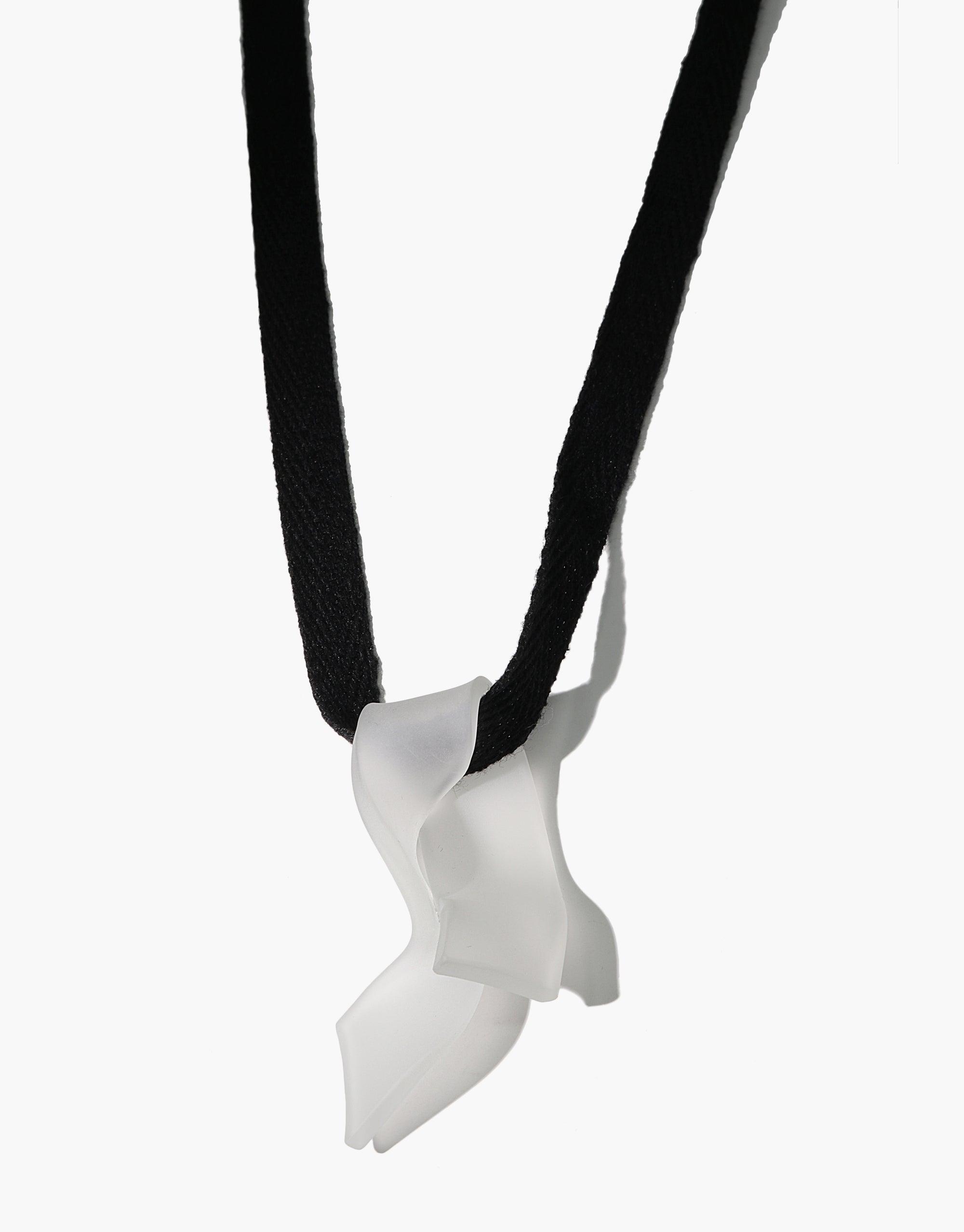 Handcrafted Ribbon Necklace featuring a unique serpentine-shaped eco gem pendant made from repurposed glass, suspended on a black cotton ribbon. Sustainable and elegant accessory showcasing artisanal craftsmanship. Ribbon Necklace by CLED