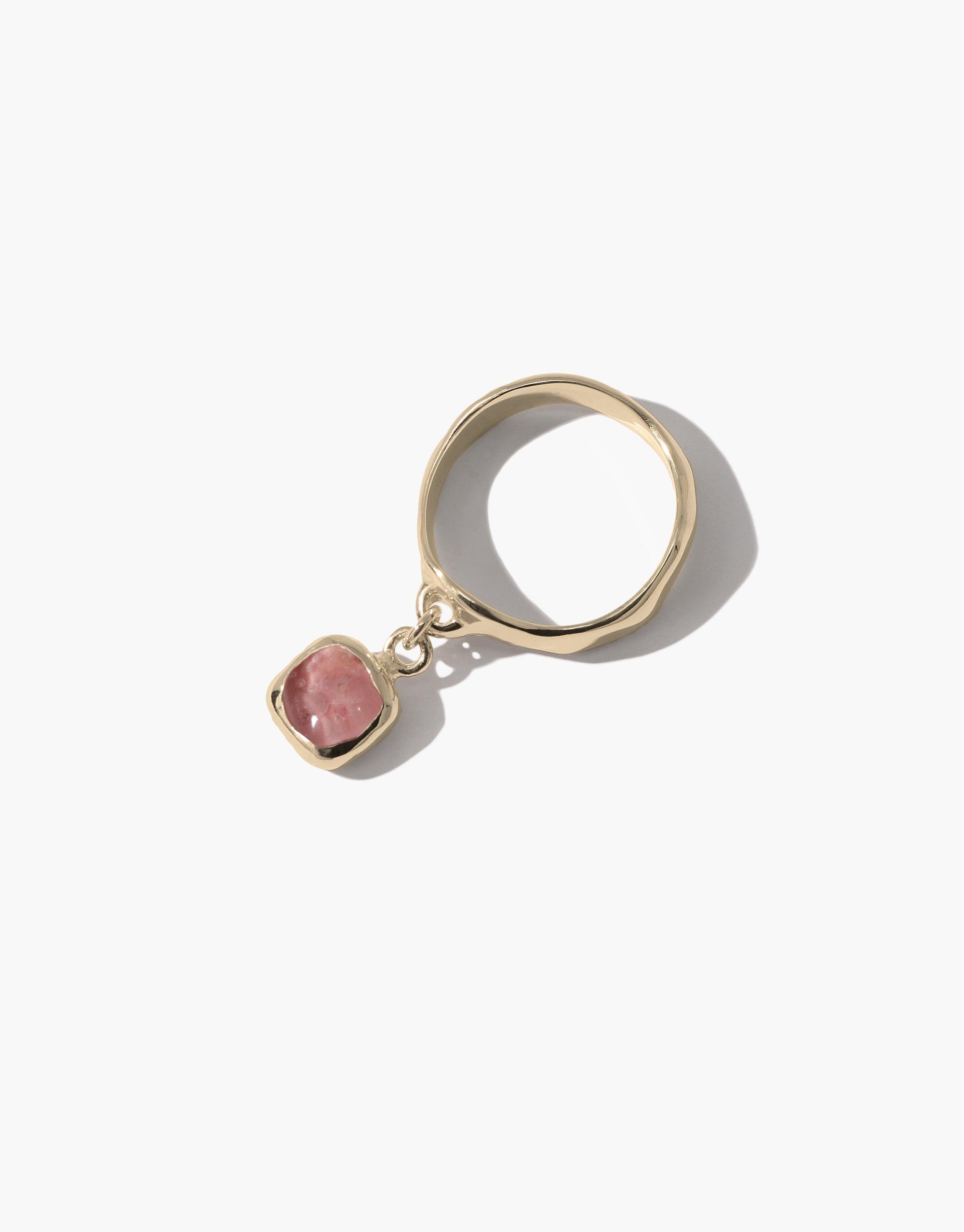 Square Dangling Ring featuring a pink Eco Gem, crafted from upcycled glass, set in a gold band. Handmade in Los Angeles with an eco-conscious design ethos.