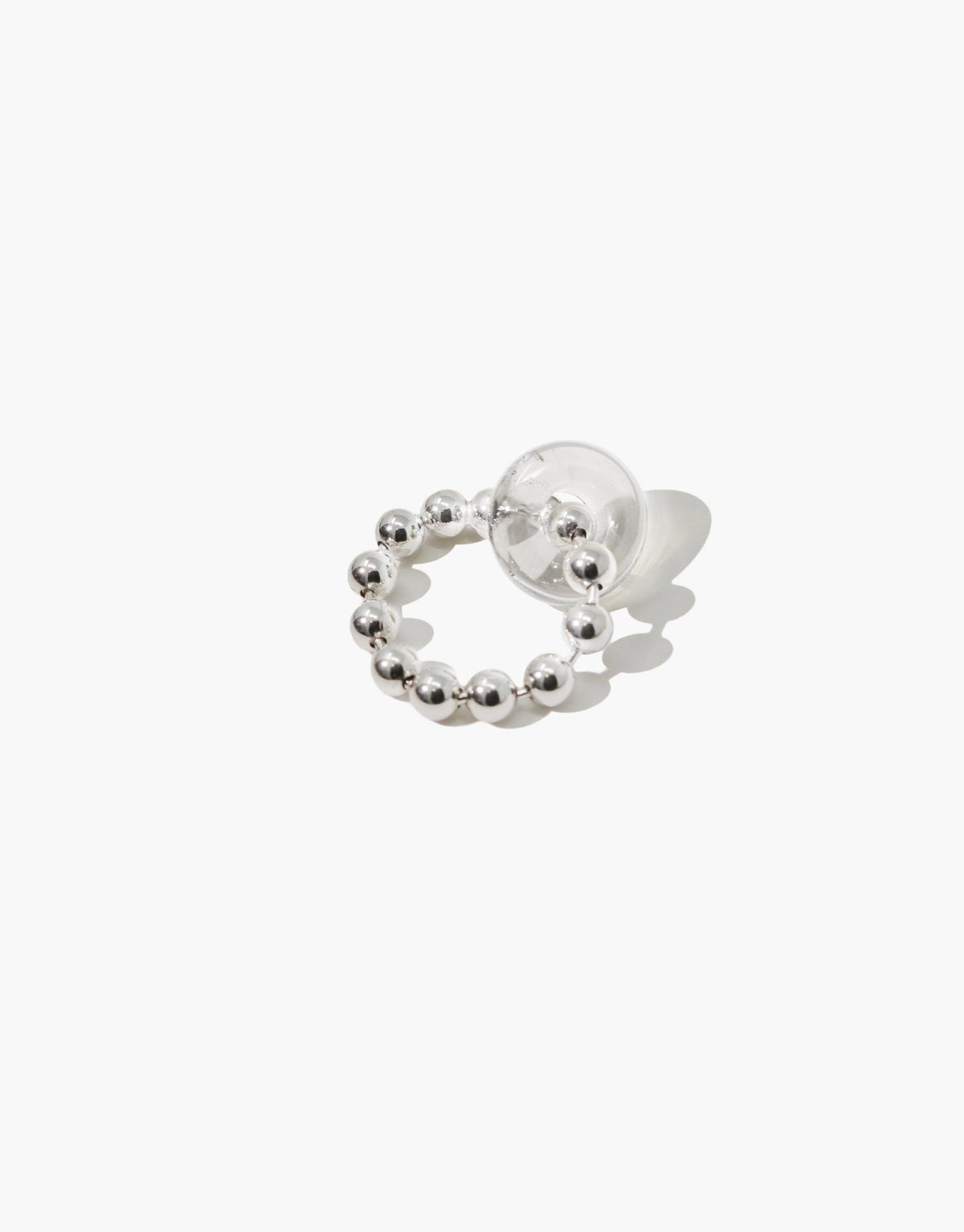 Elegant Donut Ball Ring featuring a circular design with silver beads and a transparent spherical accent, showcasing handcrafted eco-friendly jewelry made from repurposed glass. Stylish and sustainable accessory by CLED.