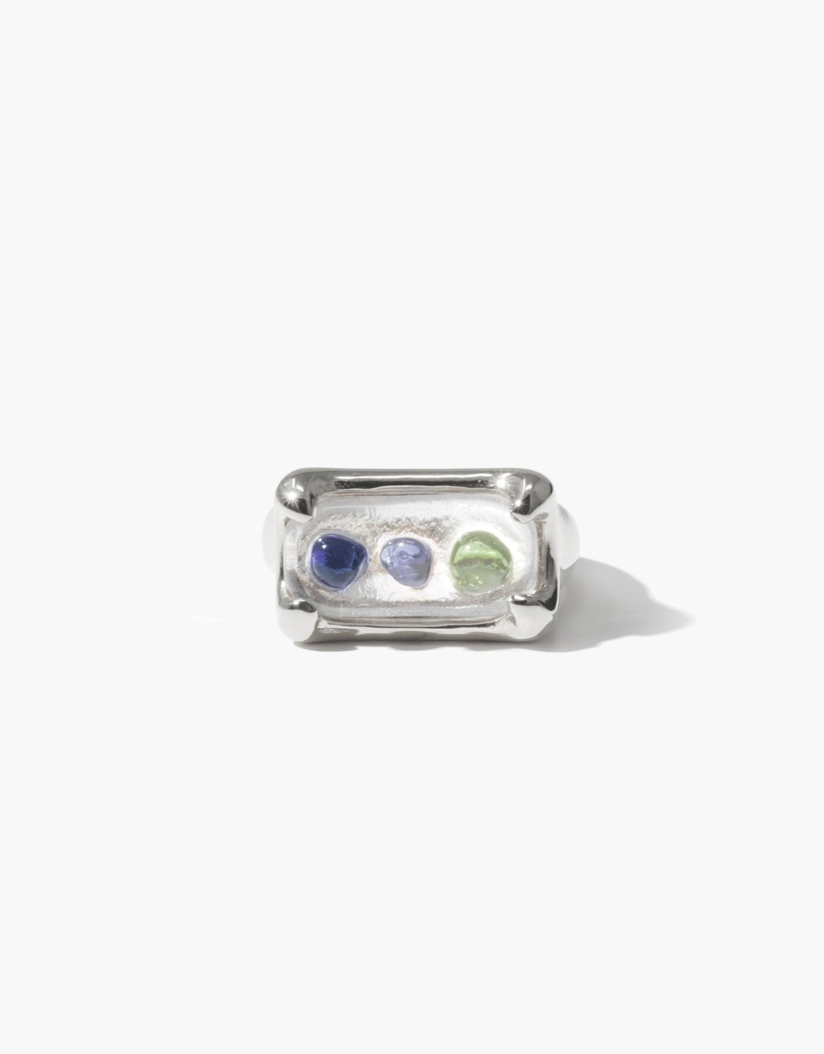 Gold plated Prism Ring featuring three eco gems in blue and green, upcycled from discarded glass. Rectangular setting with curved edges. Handcrafted jewelry inspired by prismatic light refraction. Sustainable and unique design by CLED. Prism Ring | Gold Plated.