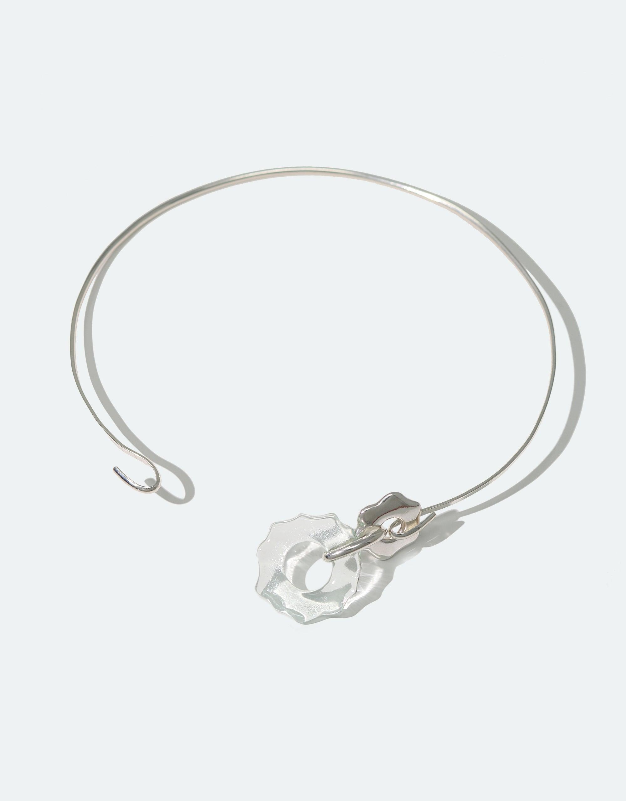 Elegant Avens Choker Necklace with delicate silver wire and translucent glass pendant, inspired by Arctic flowers. Minimalist design for versatile wear. Eco-friendly jewelry made from repurposed glass. Handcrafted sustainable accessory. CLED Avens Choker Necklace.