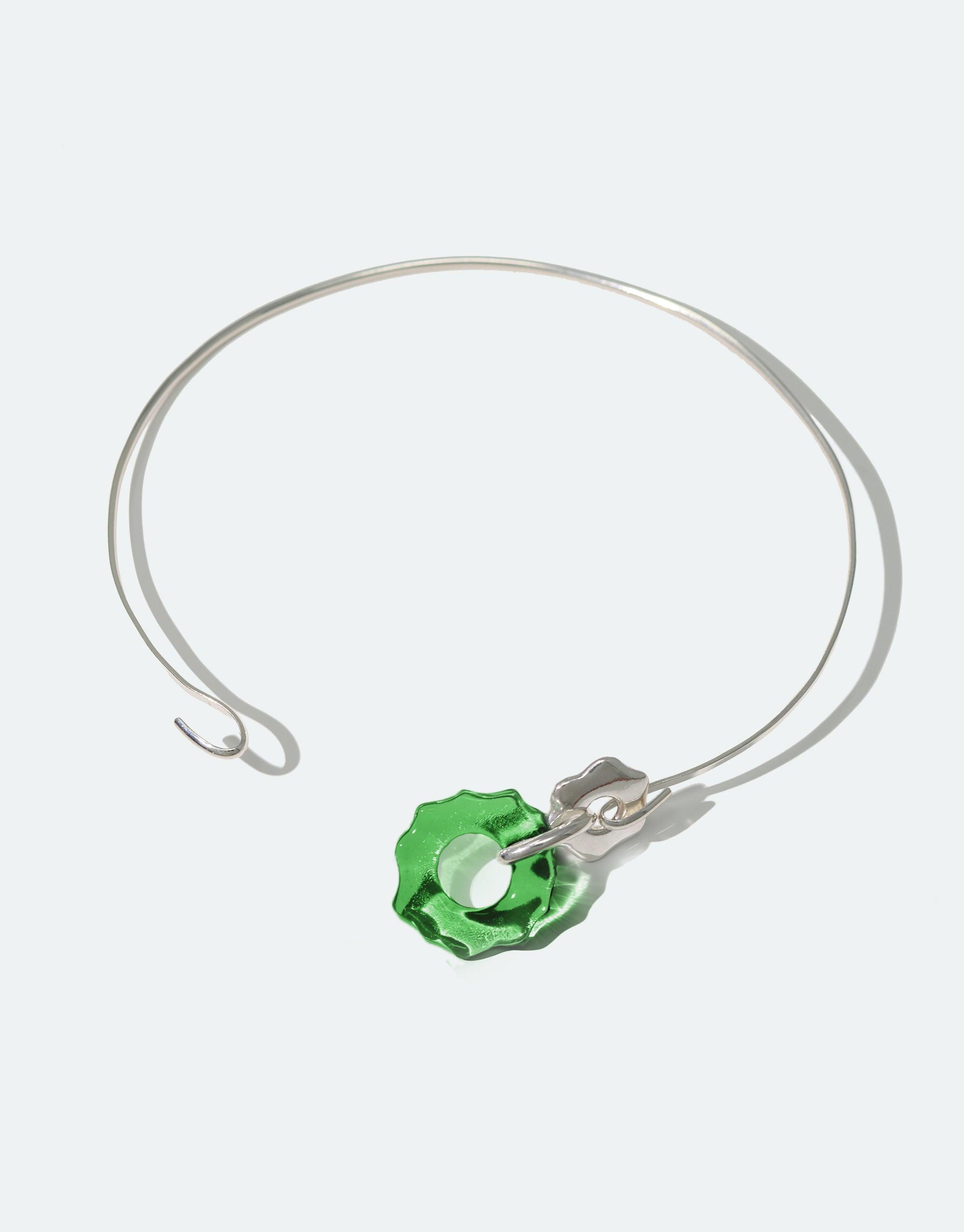 Avens Choker Necklace featuring a delicate silver wire design with a single green glass pendant, inspired by Arctic flowers. Eco-friendly jewelry made from repurposed glass bottles. Minimalist and elegant, suitable for day to evening wear. CLED