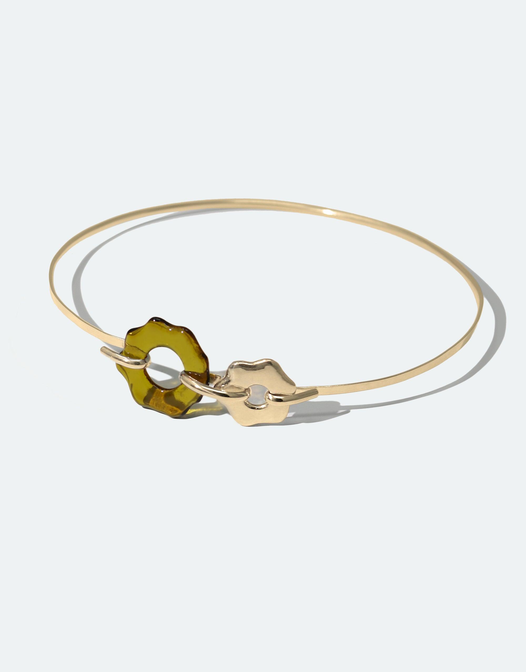 Elegant Avens Choker Necklace featuring delicate gold band with green glass petal and gold flower charm, inspired by Arctic flora. Eco-friendly jewelry made from recycled materials. Minimalist design for versatile wear. Handcrafted sustainable accessory by CLED.