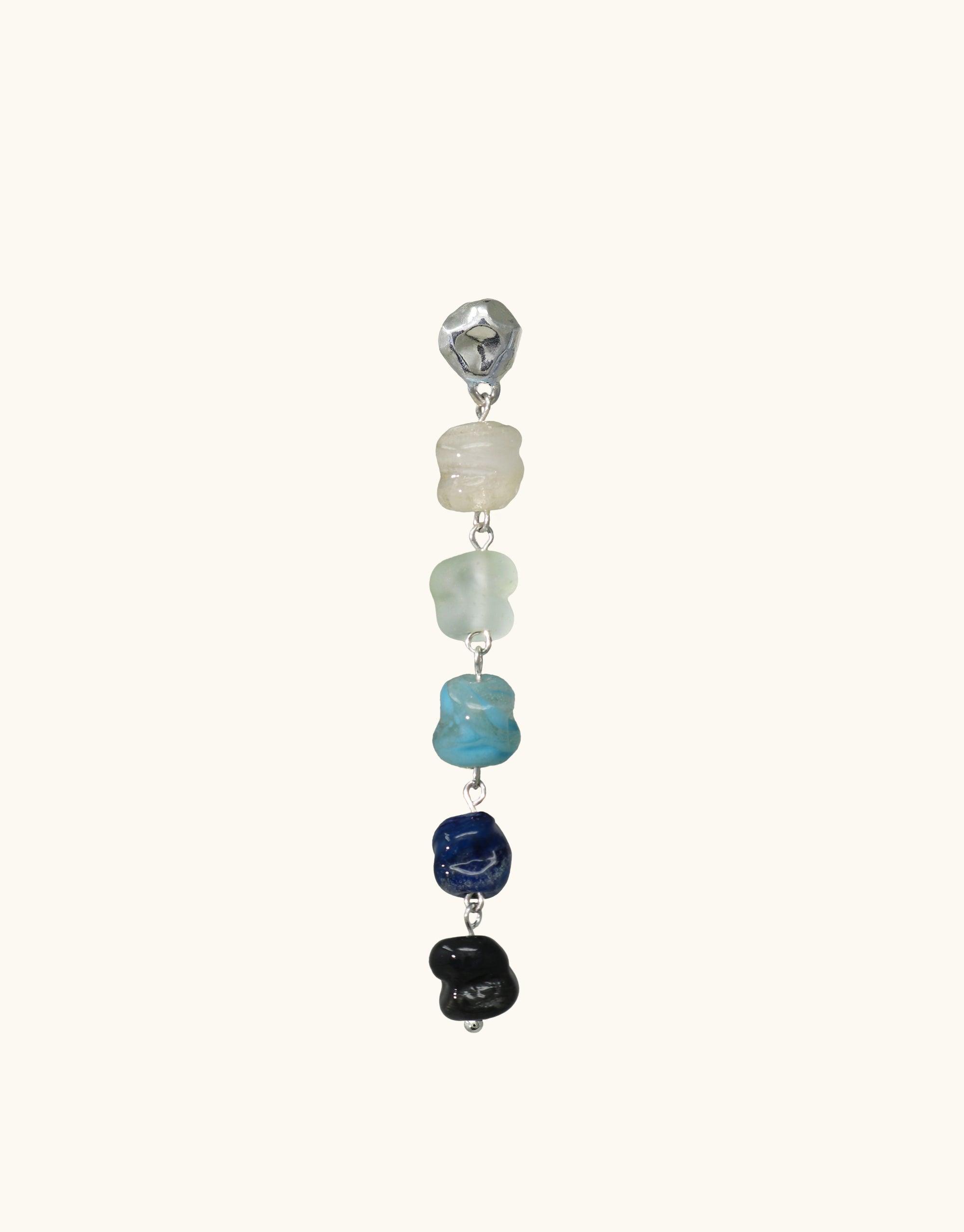 Cascading blue ombre eco glass beads in Shades of Nature Waterfall Earrings, inspired by canyon terrain. Handcrafted sterling silver jewelry featuring repurposed glass in various sizes and shades, from clear to navy. Sustainable and elegant design by CLED.