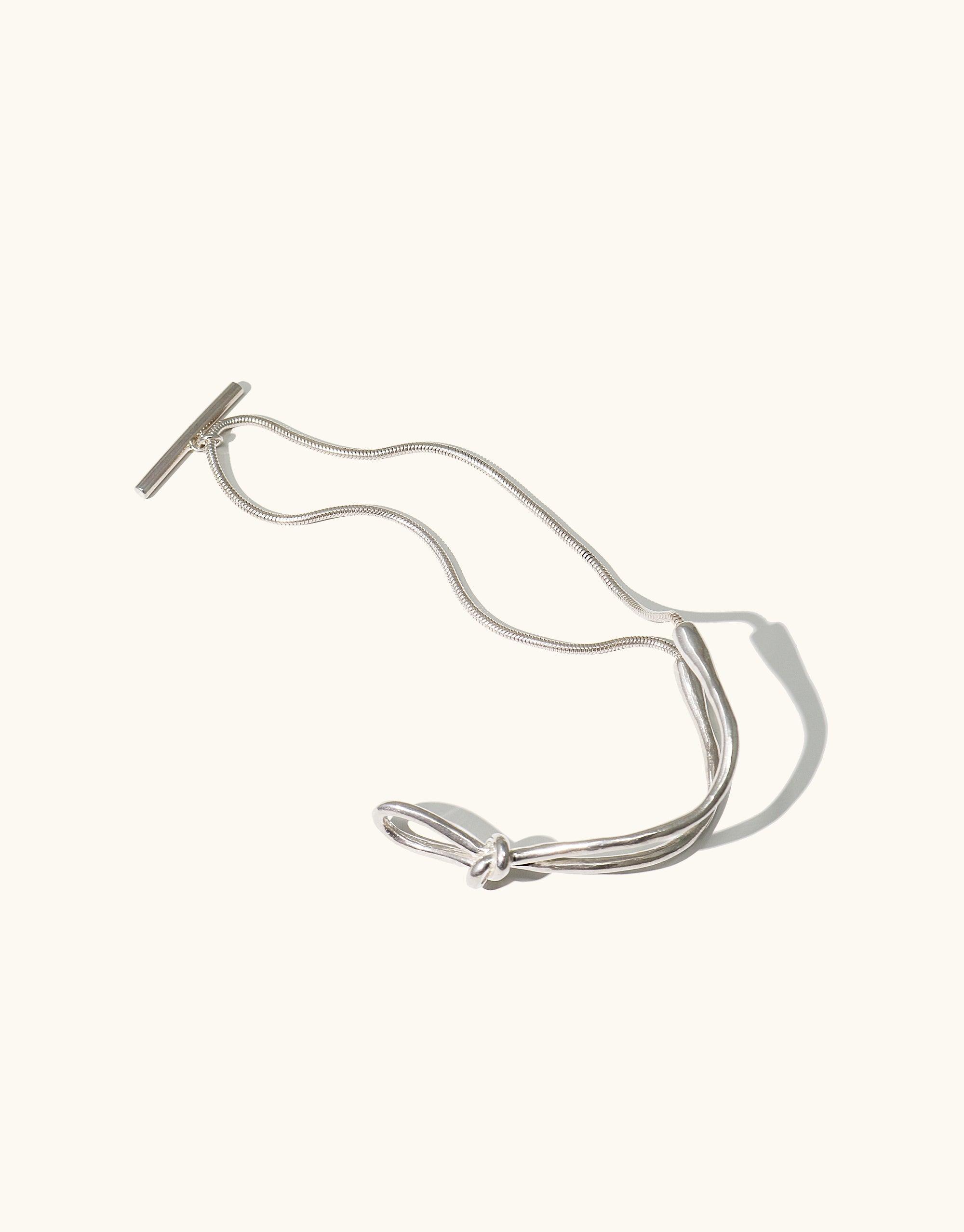 Double Rope Toggle Bracelet featuring fluid metal design inspired by canyon terrain, with chain toggle closure. Handmade in Los Angeles, available in Sterling Silver or Gold Vermeil. Stylish accessory from the Terrain Collection by CLED.