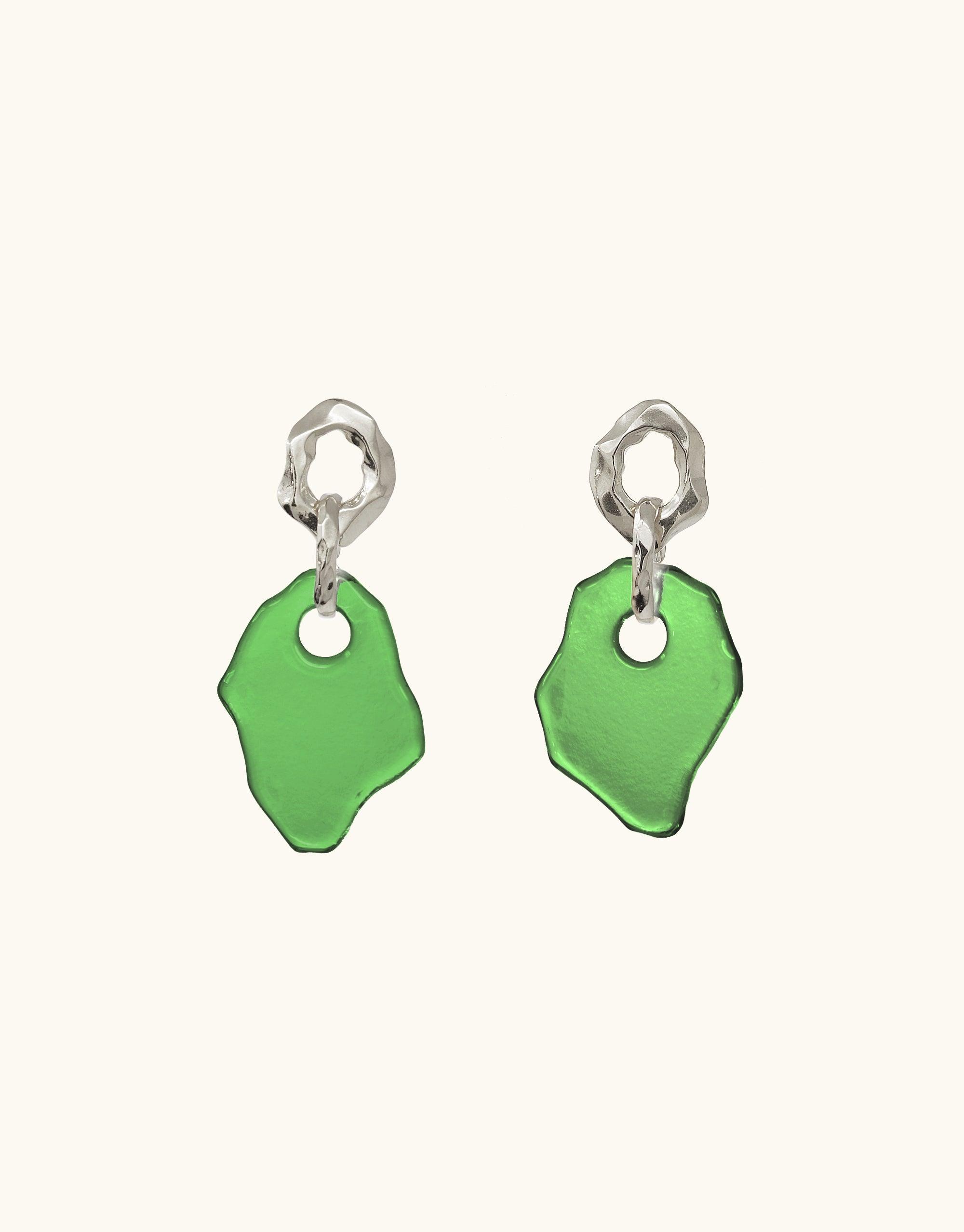 Handcrafted Canyon Earrings featuring organic silver loops and vibrant green glass pendants, inspired by canyon terrain. Eco-friendly design with repurposed glass. Unique, abstract shapes showcase the beauty of natural landscapes. Sustainable jewelry by CLED.
