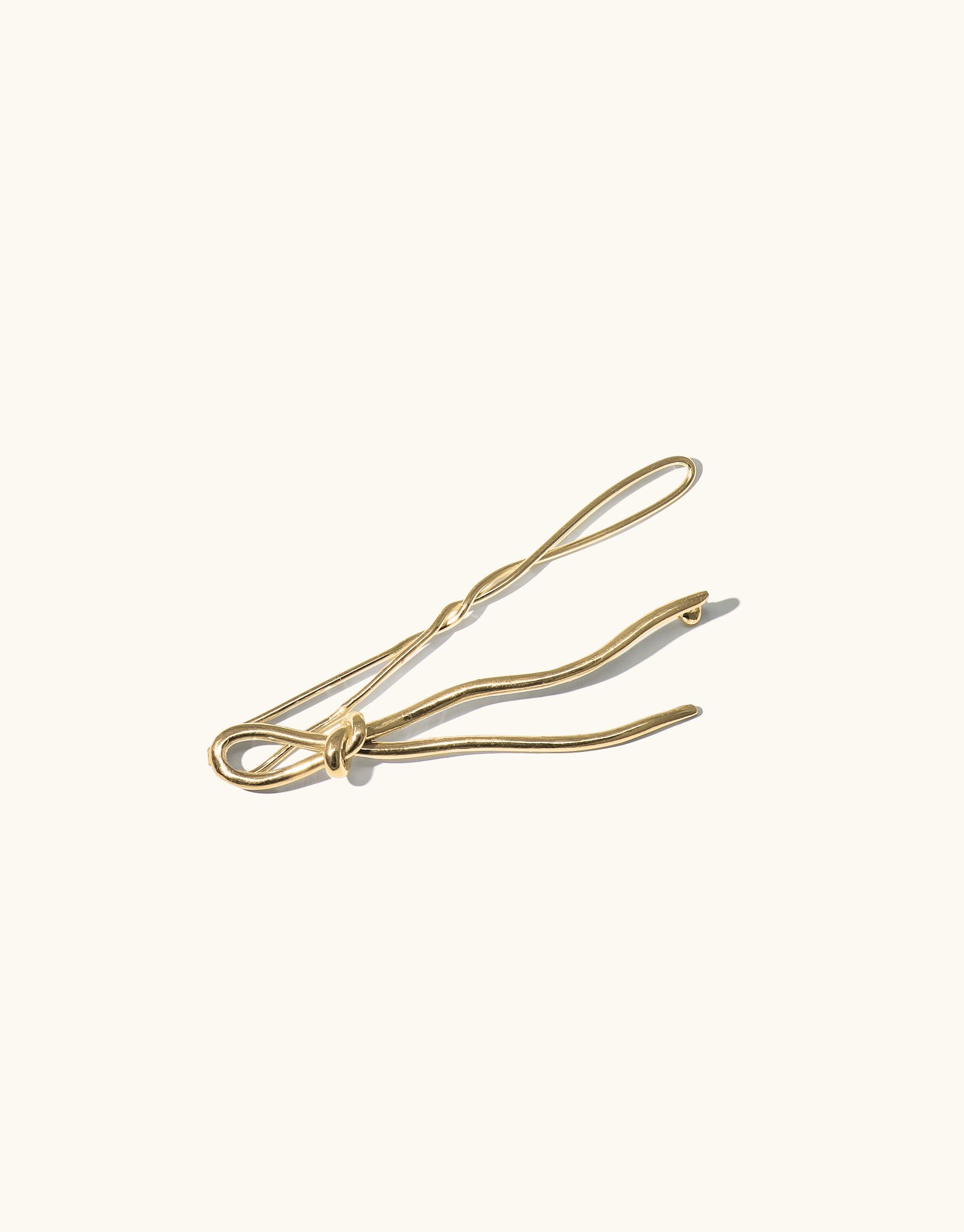Elegant gold-toned Double Rope Hair Barrette with curved design, inspired by canyon terrain. Handcrafted ornate accessory adds sparkle to hairstyles. Part of the Terrain Collection by CLED.