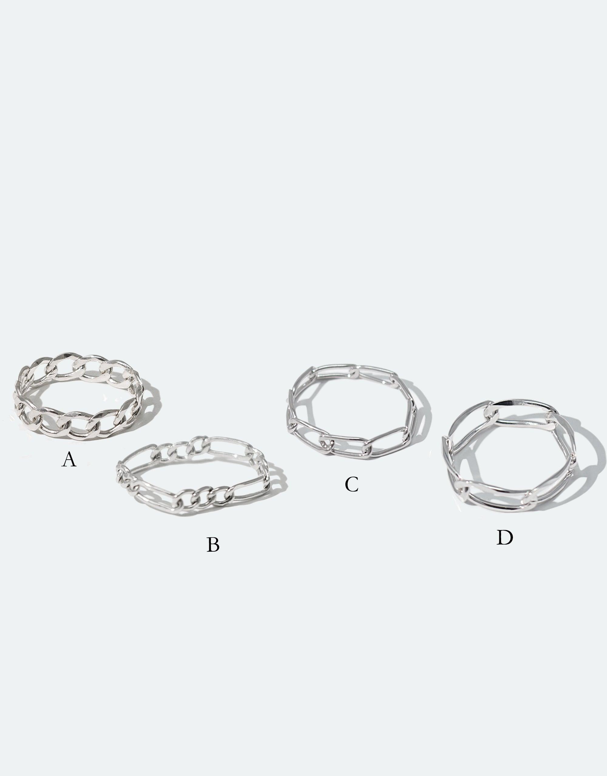 Four sterling silver collapsible chain rings in various styles, labeled A through D, showcasing different link designs and sizes. Versatile and stackable jewelry pieces. Collapsible Chain Ring | D by CLED