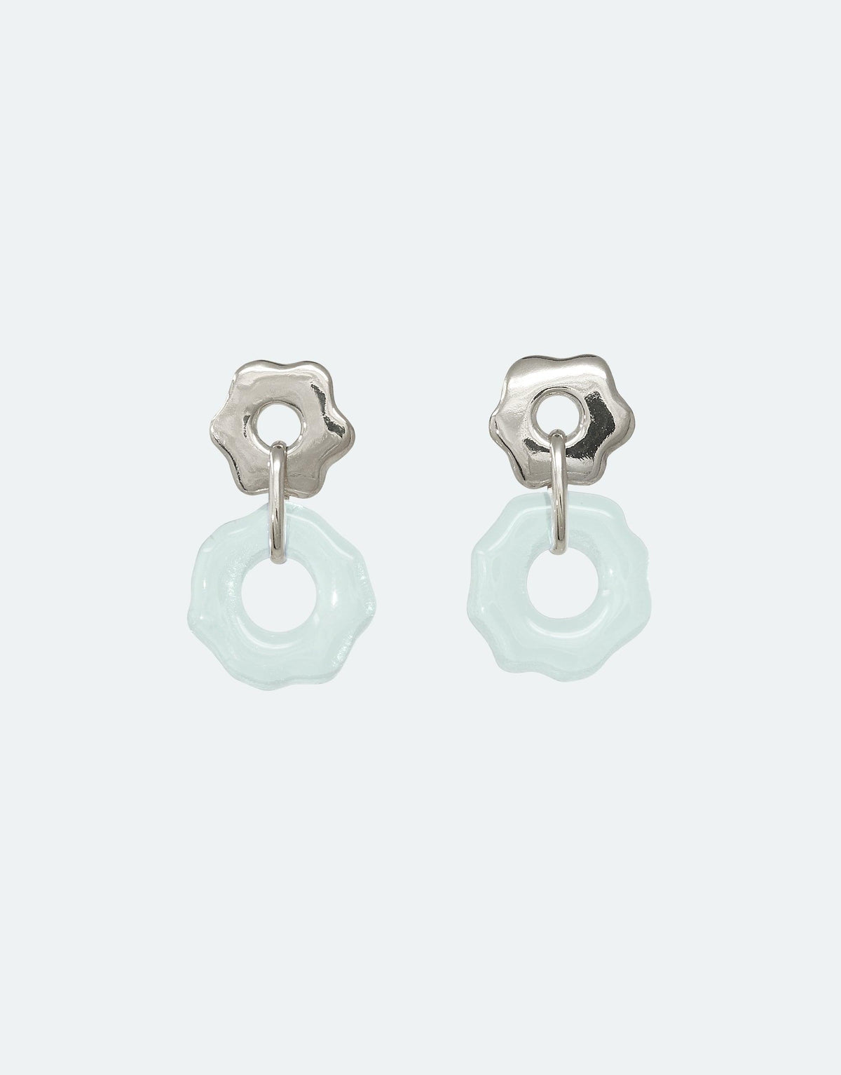 Avens Earrings featuring delicate flower-shaped silver studs with translucent light blue circular pendants made from eco-friendly repurposed glass, showcasing sustainable jewelry design inspired by Arctic flora and climate awareness CLED
