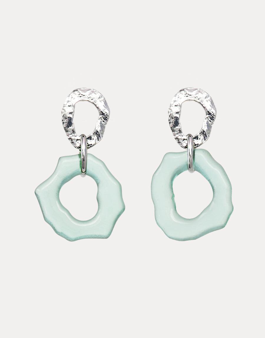 Sterling silver earrings with textured hoops and seafoam green glass pendants. Ocean-inspired design featuring irregular shapes reminiscent of sea glass. Elegant and eco-friendly statement piece. High Tide Earrings by CLED.