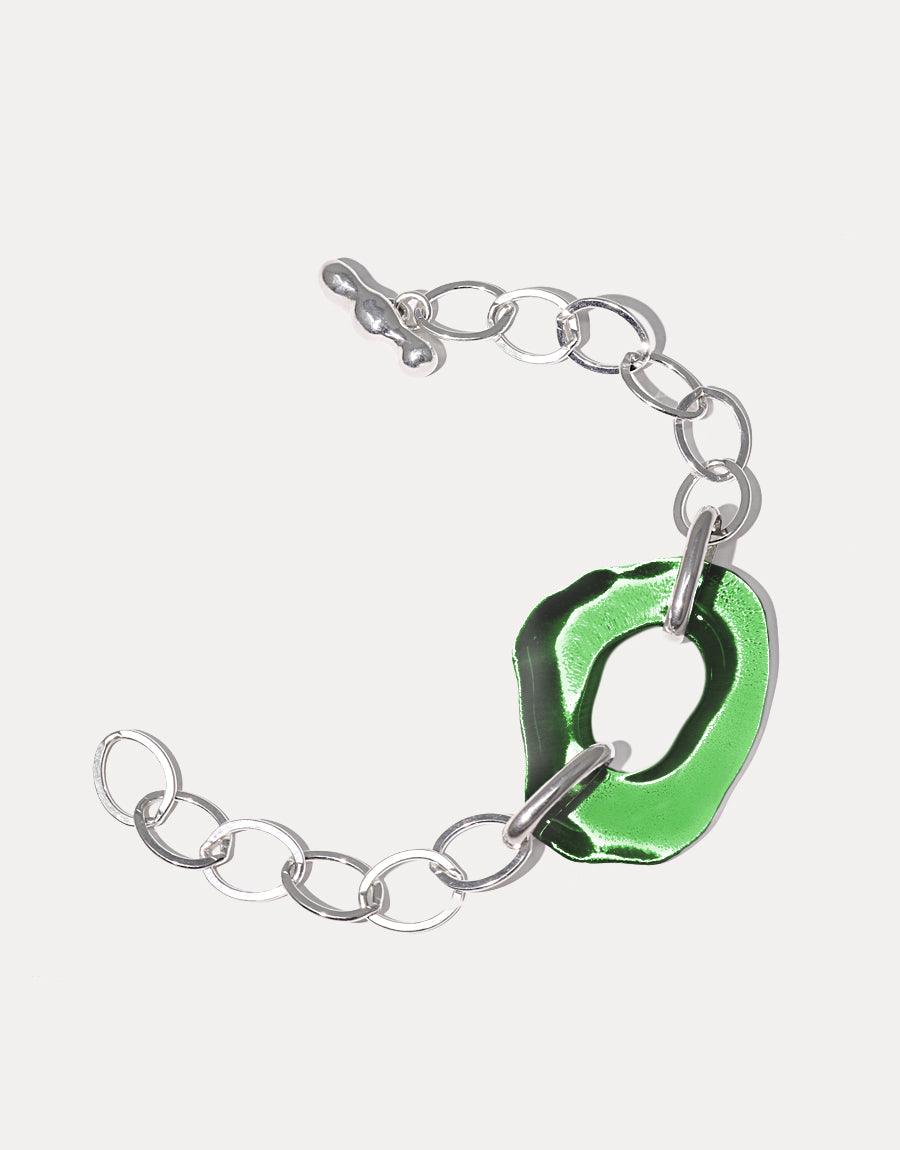 Sterling silver oval chain bracelet with organic free-shaped green eco-gem charm made from repurposed glass bottles. High Tide Oval Chain Bracelet features handcrafted links and a unique sustainable design. CLED