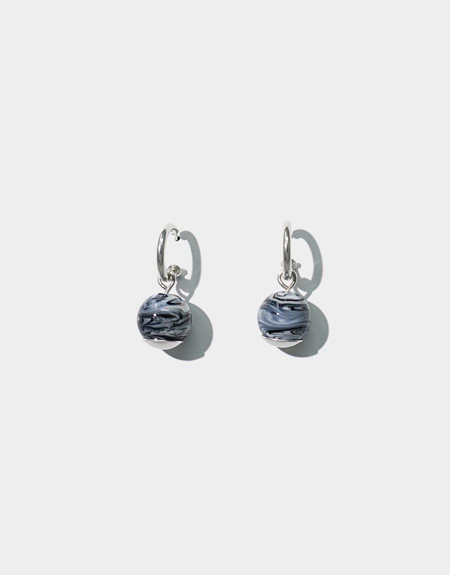 Elegant Drop Hoop Earrings featuring sterling silver hoops with dangling marbled glass beads. Handcrafted in Los Angeles, these versatile earrings offer a classic accent for any outfit. Sustainable design with repurposed glass. Drop Hoop Earrings by CLED.