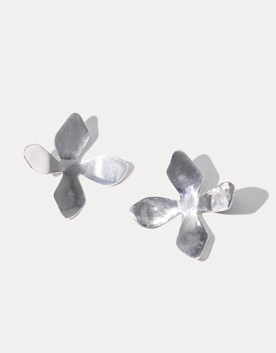 Elegant Petal Earrings in recycled sterling silver, featuring delicate four-petal flower design inspired by California wildflowers. Handcrafted in Los Angeles, these 1.5-inch long earrings showcase a lightweight, nature-inspired aesthetic. Perfect for spring and summer styling. CLED Petal Earrings.