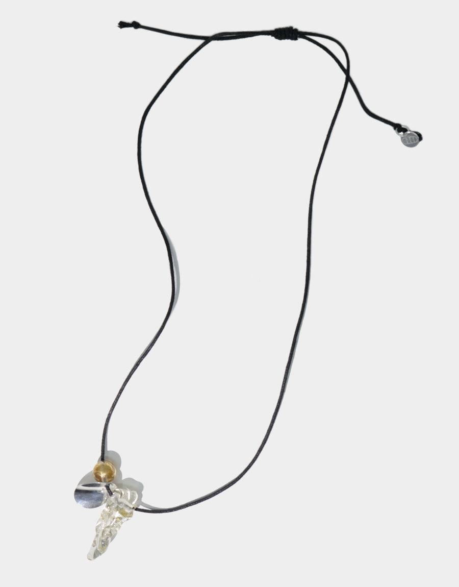 Amorphous Long Cluster Necklace featuring black cotton cord with adjustable length, showcasing three unique charms including a gold metallic accent, clear amorphous gem, and wavy disc pendant. Handcrafted jewelry piece by CLED