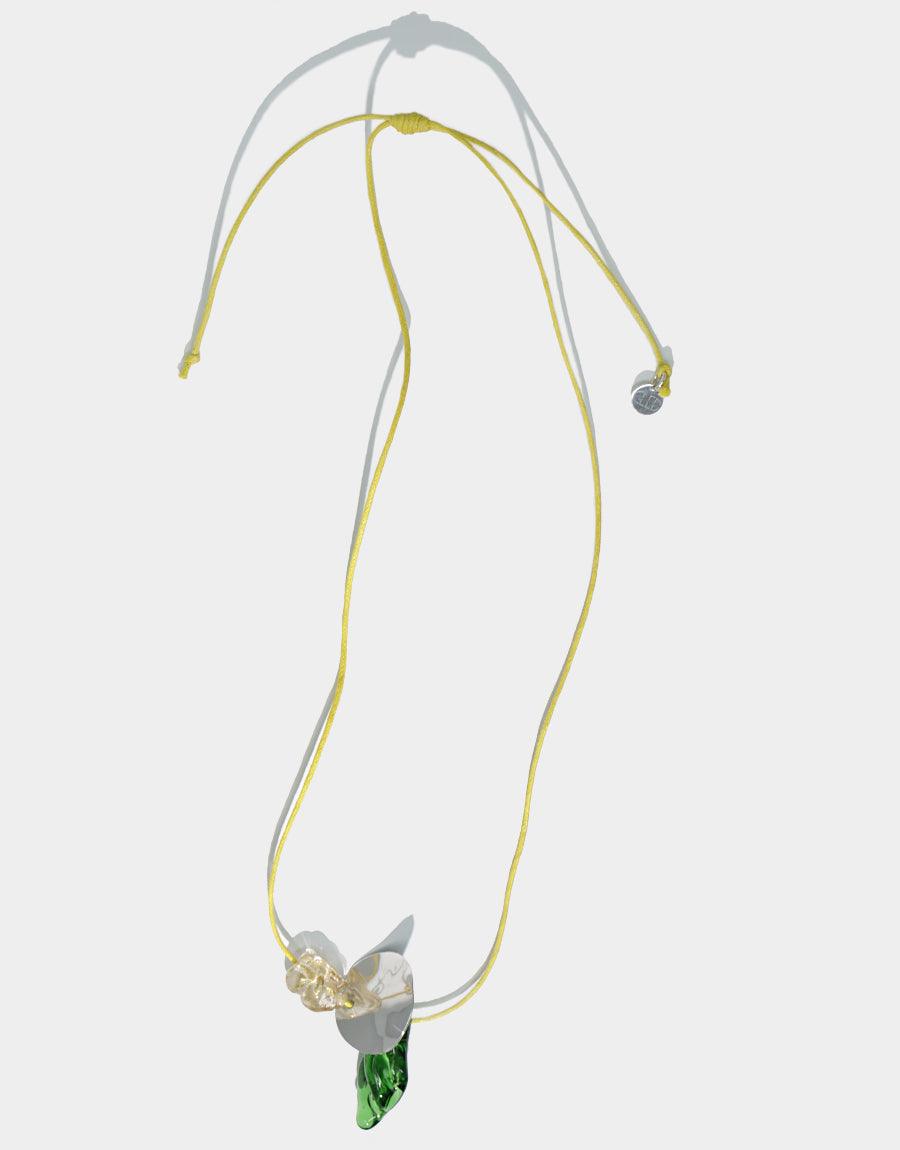 Amorphous Long Cluster Necklace featuring adjustable yellow cord with three unique charms: gold pearl, clear amorphous gem, and wavy disc. Handcrafted design showcases repurposed glass and sterling silver elements. Elegant and sustainable jewelry piece by CLED.