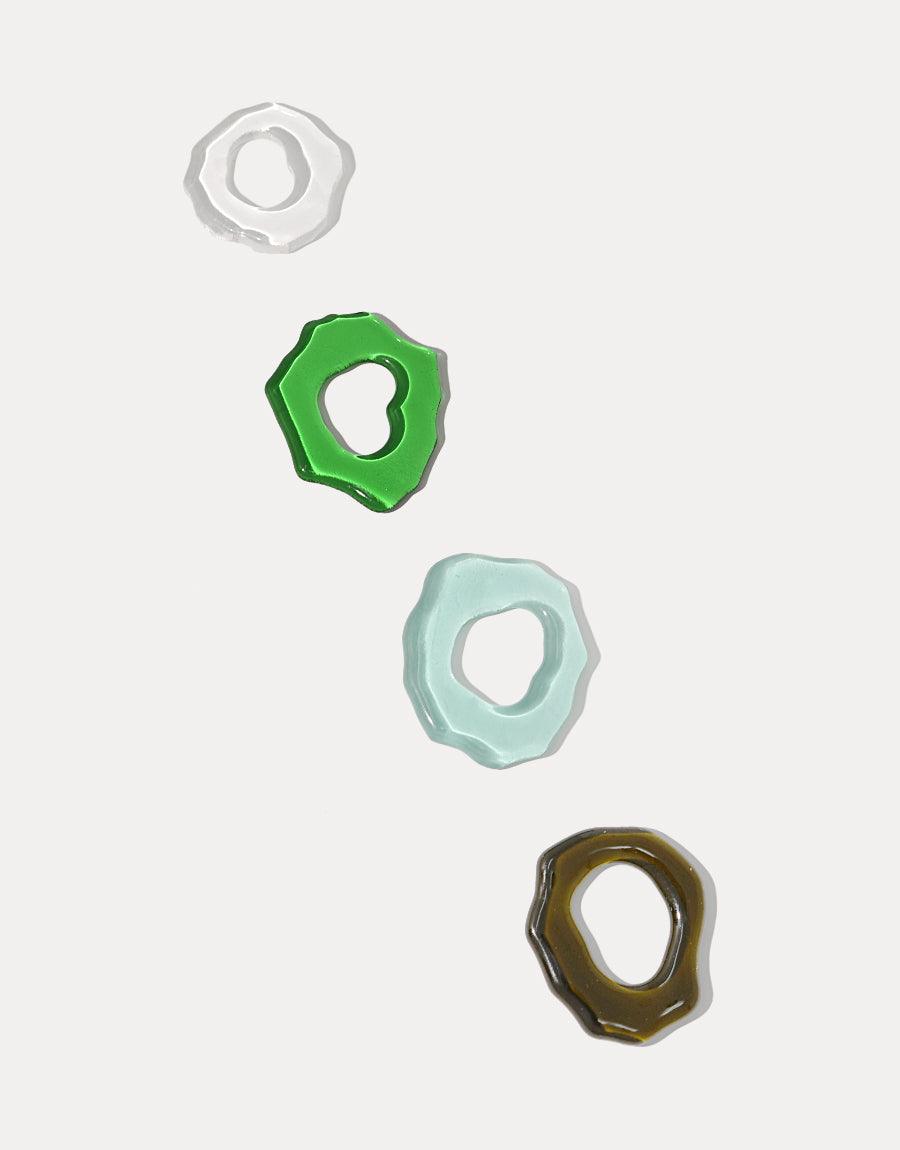 Eco-friendly oval chain links in various colors for High Tide Oval Chain Bracelet. Handcrafted from repurposed glass bottles, showcasing sustainable jewelry design. Sterling silver elements with organic shapes. Unique, eco-conscious accessory by CLED.