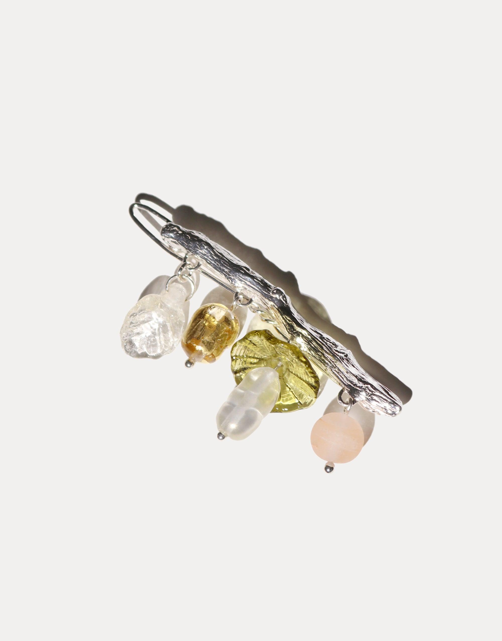 Sterling silver Floral Barrette with eco-friendly glass beads in clear, yellow, green, and pink, dangling from a textured bar. Handcrafted spring-inspired hair accessory showcasing upcycled materials. CLED Floral Barrette.