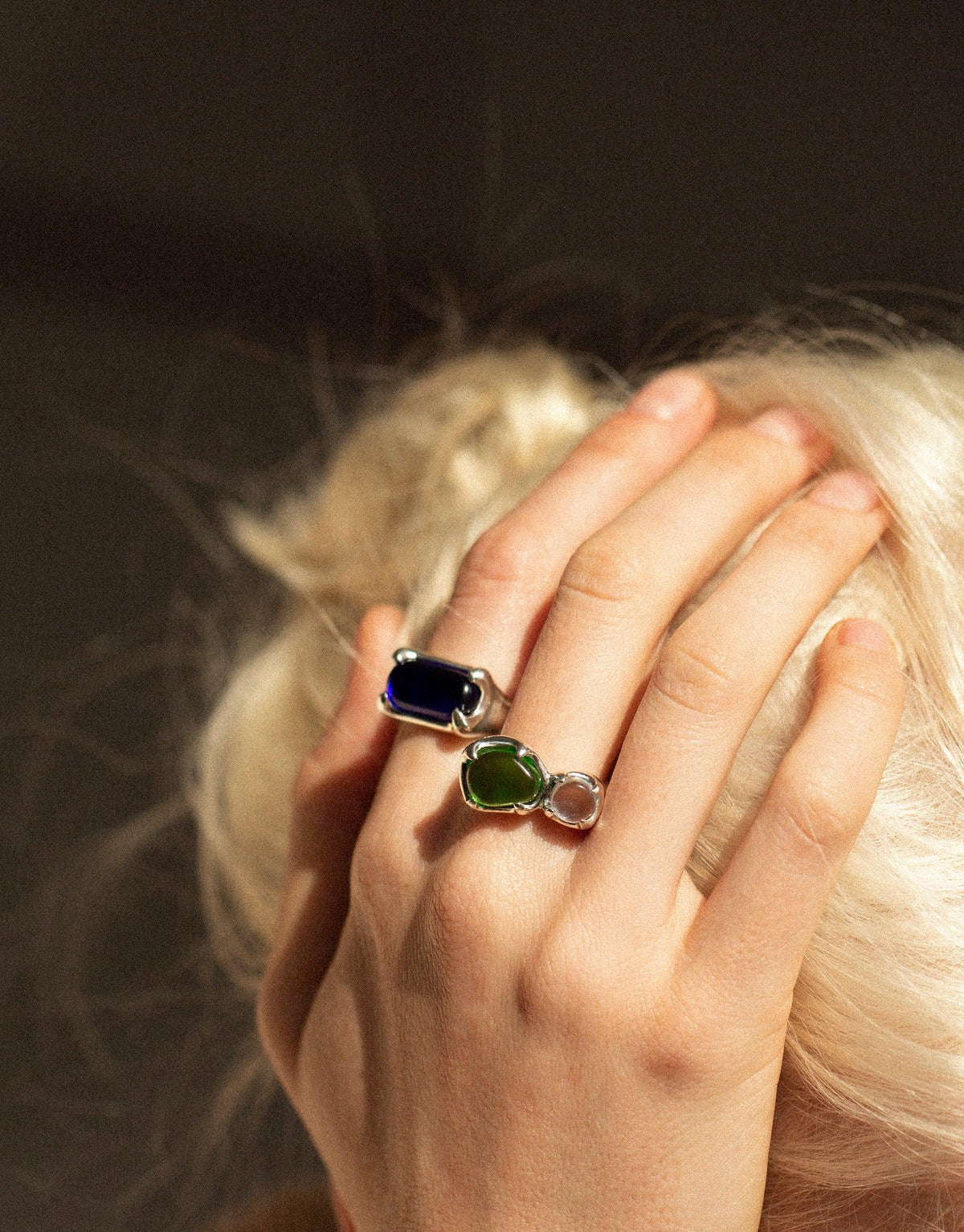 Elegant Sterling Silver Prism Ring with vibrant eco gems in blue and green, showcasing CLED's sustainable design. Hand adorning a model's finger, capturing light and color. Prism Ring | Sterling Silver by CLED.