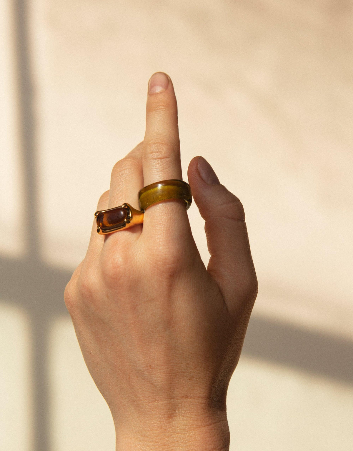 Hand wearing Prism Ring in Sterling Silver, showcasing vibrant eco gem made from upcycled glass. Unique design captures light, creating a prism-like effect. Sustainable jewelry by CLED.