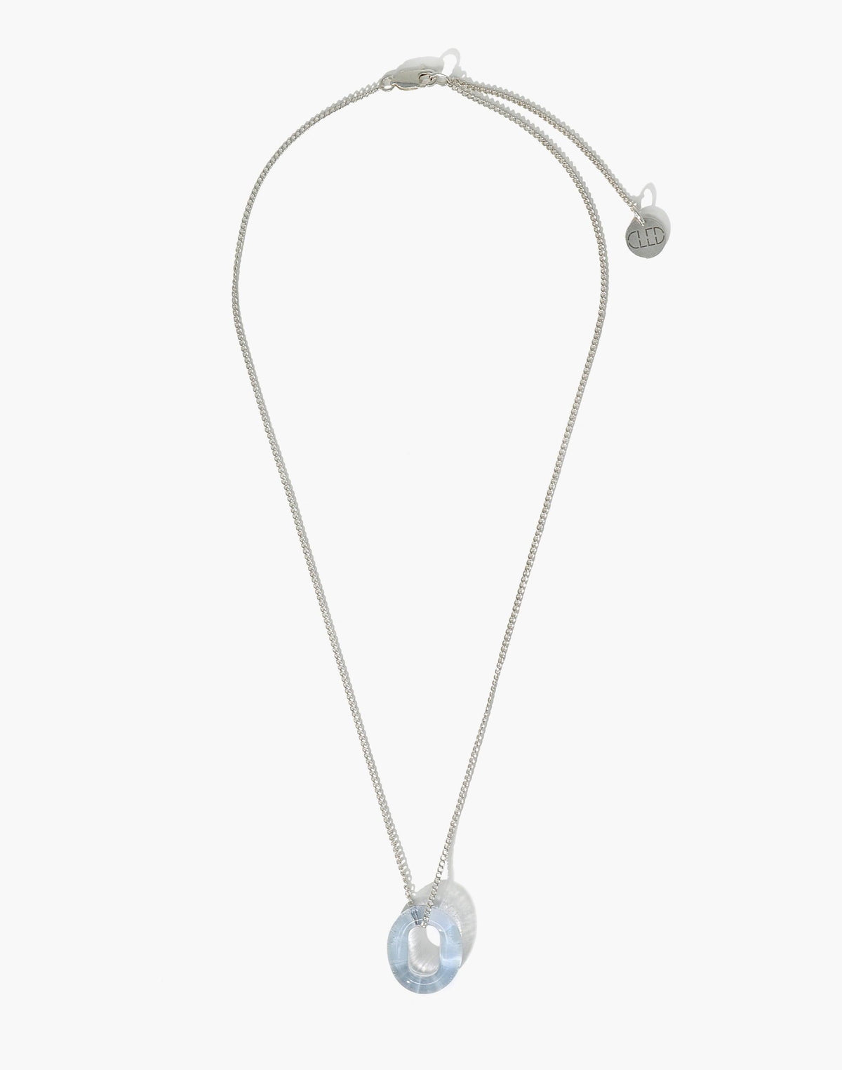 Elegant silver chain necklace with a light blue circular glass pendant, featuring a unique loop design. Adjustable length for versatile styling. Part of the Minimal Collection, showcasing sustainable eco-friendly jewelry. In The Loop Necklace by CLED.
